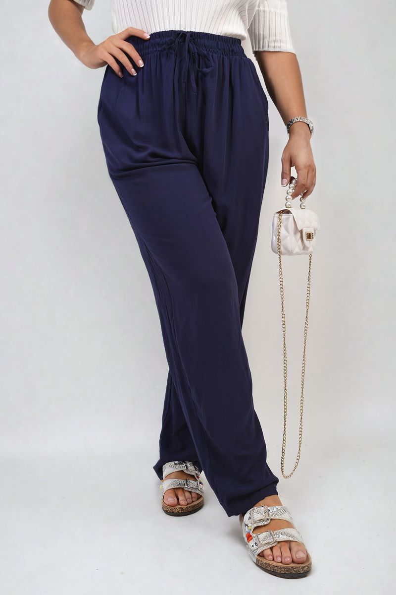 Navy high-waist drawstring pants with side pockets and gathered cuffs