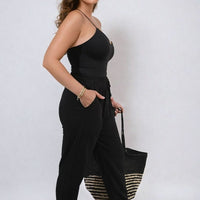 Black high-waist drawstring trousers with side pockets and relaxed wide-leg drape