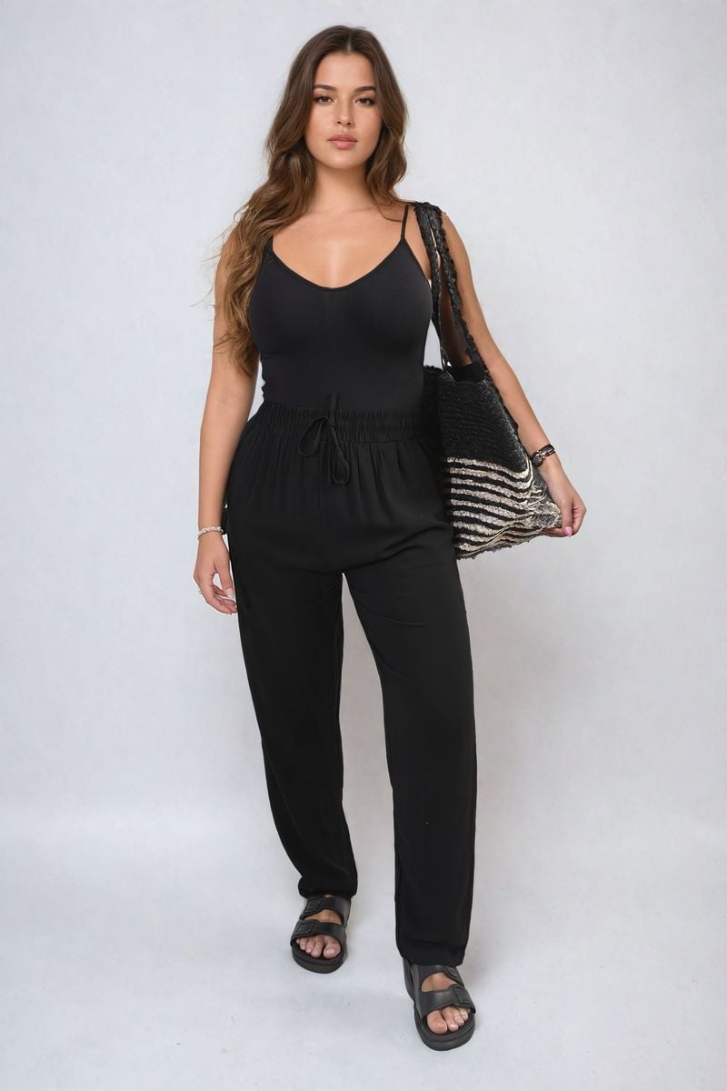 Black high-waist drawstring trousers with side pockets, relaxed straight-leg fit.