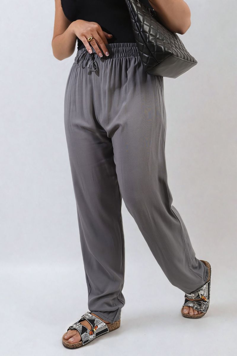 Grey high-waist drawstring trousers with side pockets and relaxed wide-leg shape.