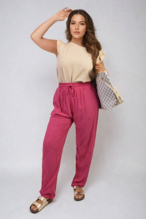 Fuchsia high-waist drawstring trousers with side pockets and loose straight legs