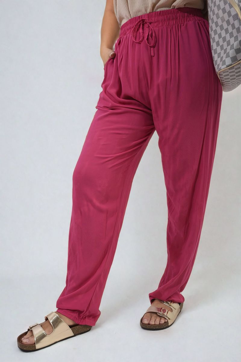 Fuchsia high-waist drawstring trousers with side pockets, flowy wide-leg silhouette.