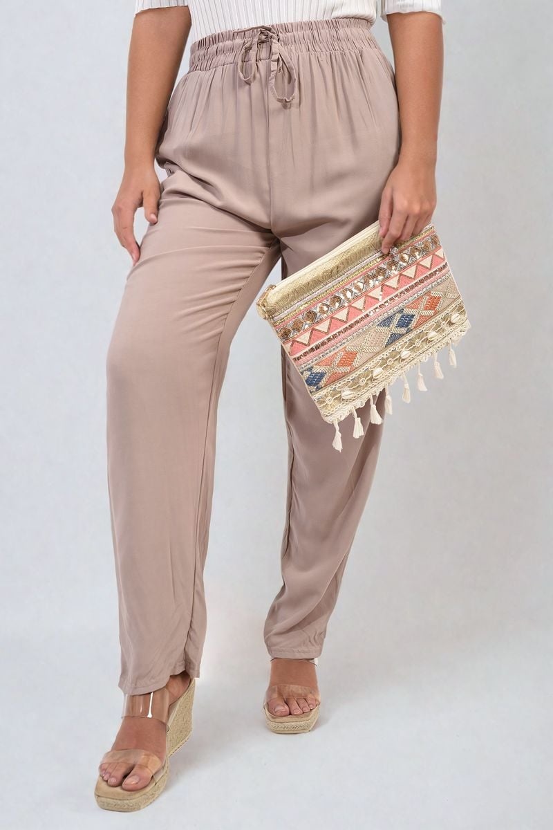 Taupe high-waist drawstring trousers with side pockets and gathered waist detail