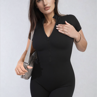 Black rib knit zip-front short sleeve playsuit with fitted shorts