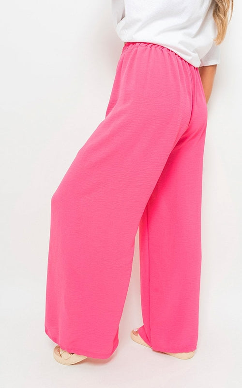 Pink fuchsia wide-leg trousers with drawstring gathered waist and airy, wide legs