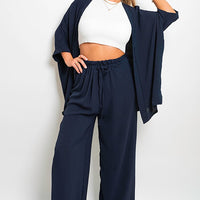 Navy wide-leg trousers with drawstring gathered waist and loose flowing legs