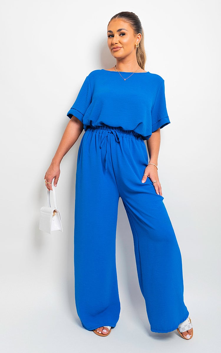 Royal blue wide-leg trousers with gathered drawstring waist, full-body view