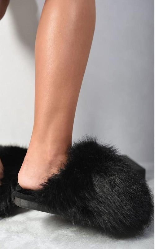Black faux fur open-back slippers with thick plush top and flat rubber sole