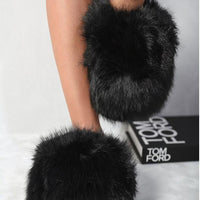Black faux fur open-back slippers with plush, rounded toe