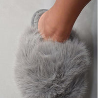 Grey faux fur open-back slippers with thick, fluffy front and flat sole