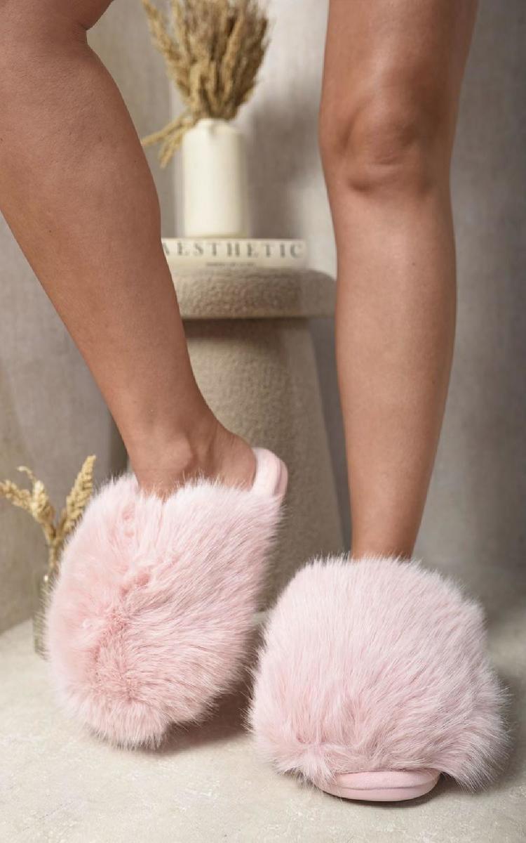 Pink faux fur open-back slippers with fluffy uppers and cushioned footbed
