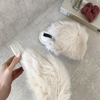 Cream faux fur open-back slippers with soft footbed and black logo label