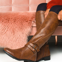 Camel knee-high boots with buckle strap detail and stacked block heel