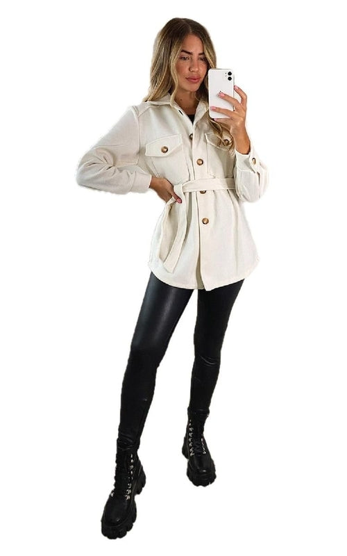 Cream belted jacket with button placket, flap chest pockets, stand collar