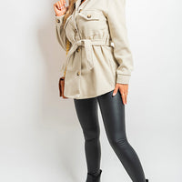 Beige belted jacket with button front, flap pockets, long sleeves