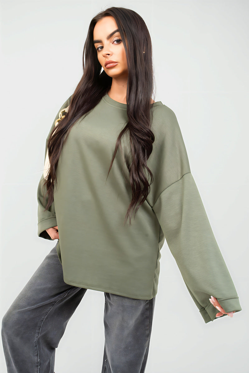 Oversized olive-green sweatshirt with round neck and long sleeves, loose relaxed fit.