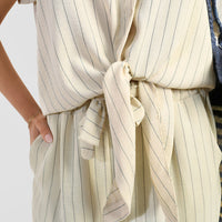 Beige striped button shirt with tied waist belt and matching wide-leg trousers