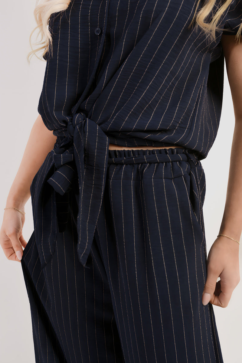 Navy pinstripe tie-front top and elastic waist trousers close-up