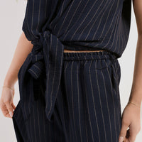 Navy pinstripe tie-front top and elastic waist trousers close-up
