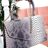 Faux Leather Handbag in Lilac with Top Handle and Chain Strap
