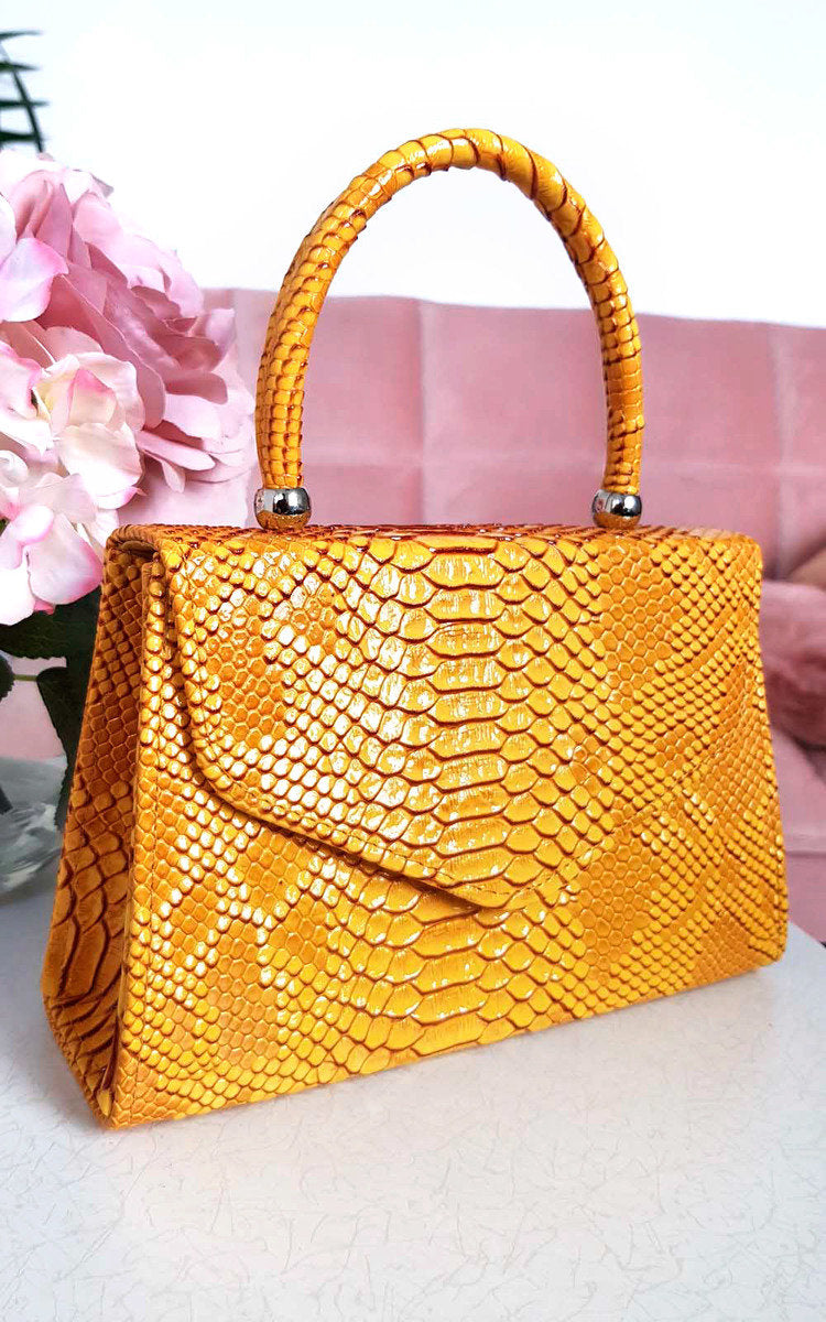 Faux Leather Handbag in Lilac with Top Handle and Chain Strap