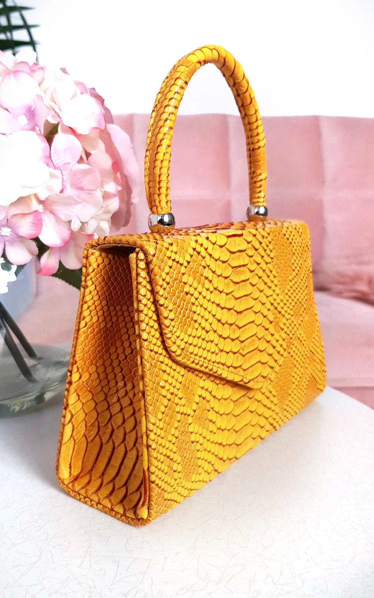 Faux Leather Handbag in Lilac with Top Handle and Chain Strap