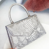 Faux Leather Handbag in Lilac with Top Handle and Chain Strap