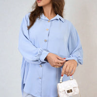 Light blue oversized collared button-down top, long sleeves, front button placket