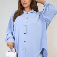 Light blue oversized collared button-down top with long sleeves and button front