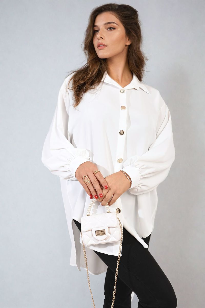 Oversized collared white button-down shirt with button-front placket and roomy long sleeves