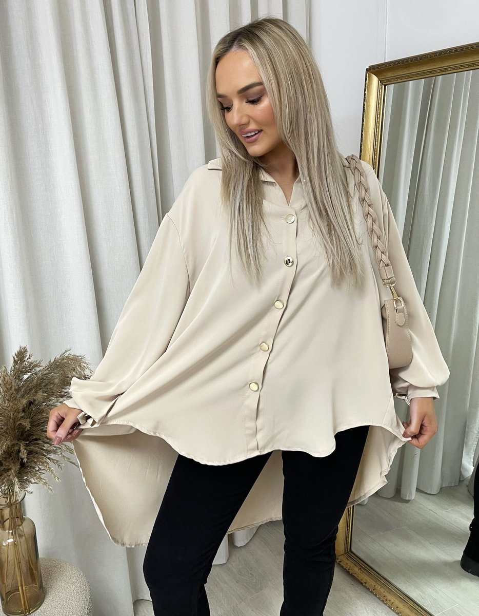Beige oversized collared button-down top with long sleeves and button placket