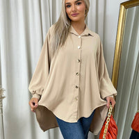 Oversized collared button-down shirt in beige with long puff sleeves and front buttons