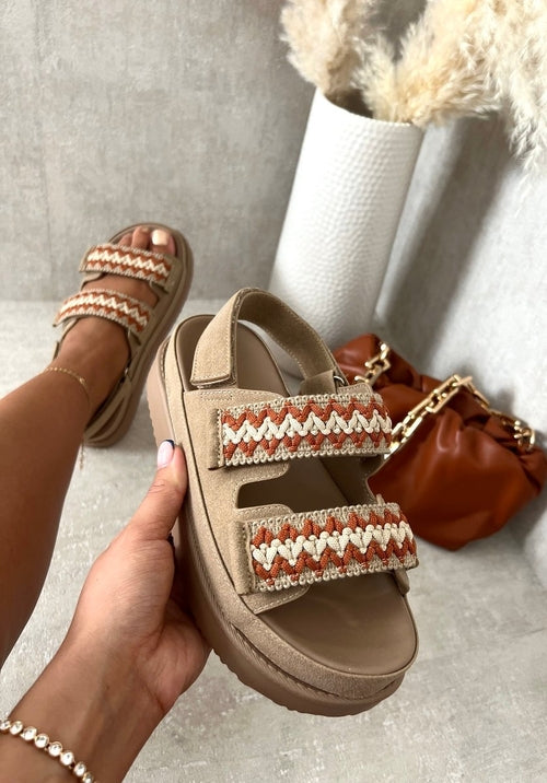 Khaki platform sandals with red-and-white crochet trim and double-buckle strap
