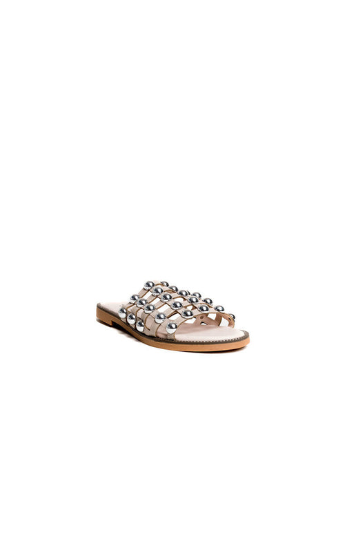 Nude flat slide sandals with silver studded lattice straps and open toe
