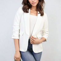 Off-white open-front blazer with ruched sleeves and front pockets, three-quarter sleeves