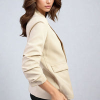 Cream/beige open front blazer with ruched sleeves and front patch pocket