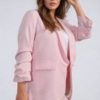 Light pink open-front blazer with ruched sleeves and front pockets, relaxed fit