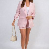 Open-front ruched-sleeve blazer jacket in light pink with front pockets and lapels.