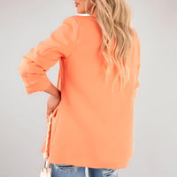 Orange open front blazer jacket with ruched sleeves and back drape
