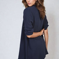 Navy open-front cardigan with three-quarter sleeves and loose draped silhouette