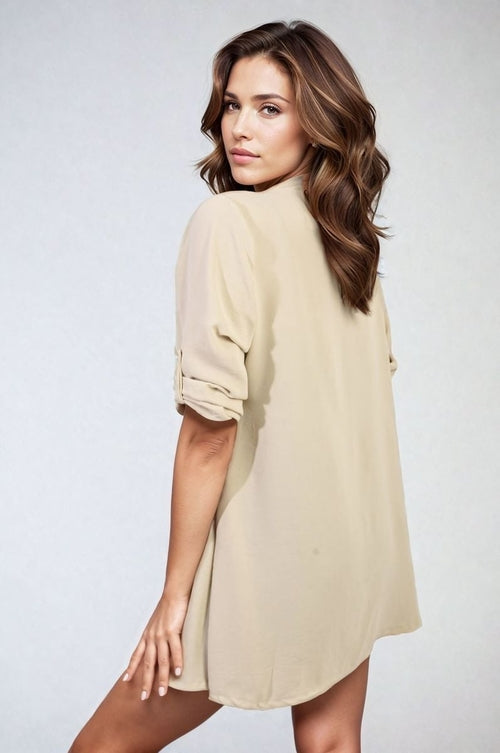 Cream open-front cardigan with rolled short sleeves and relaxed drape
