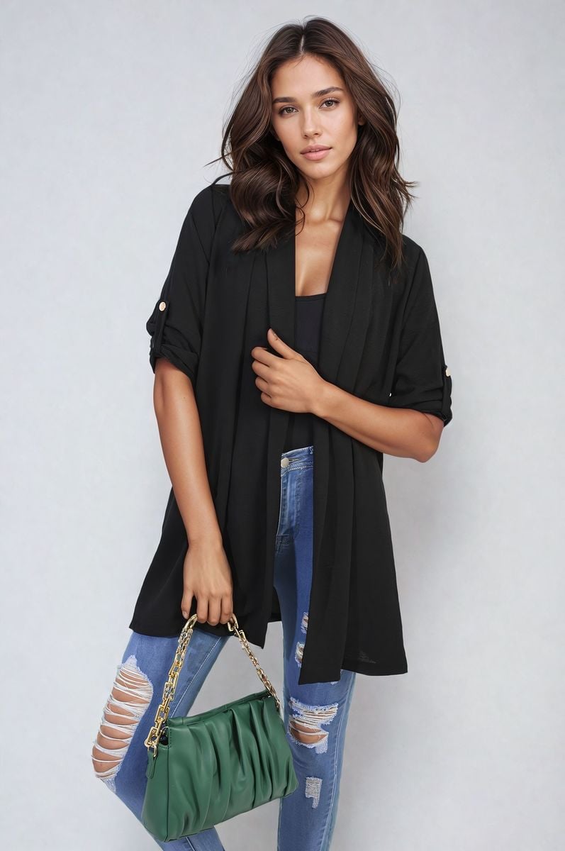 Black open-front cardigan with short sleeves and side pockets, draped over jeans