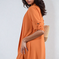 Orange open-front cardigan with rolled sleeves and button cuff detail
