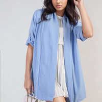 Powder blue open-front cardigan with rolled short sleeves and draped front