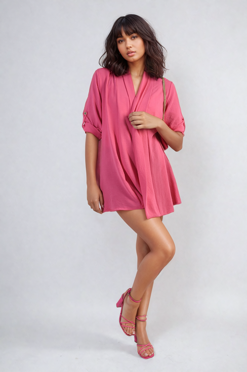 Pink open-front cardigan with rolled short sleeves and loose draped fit
