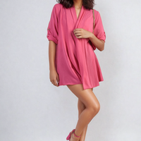 Pink open-front cardigan with rolled short sleeves and loose draped fit
