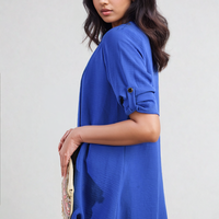 Blue open-front cardigan with roll-up sleeves and button detail at cuff