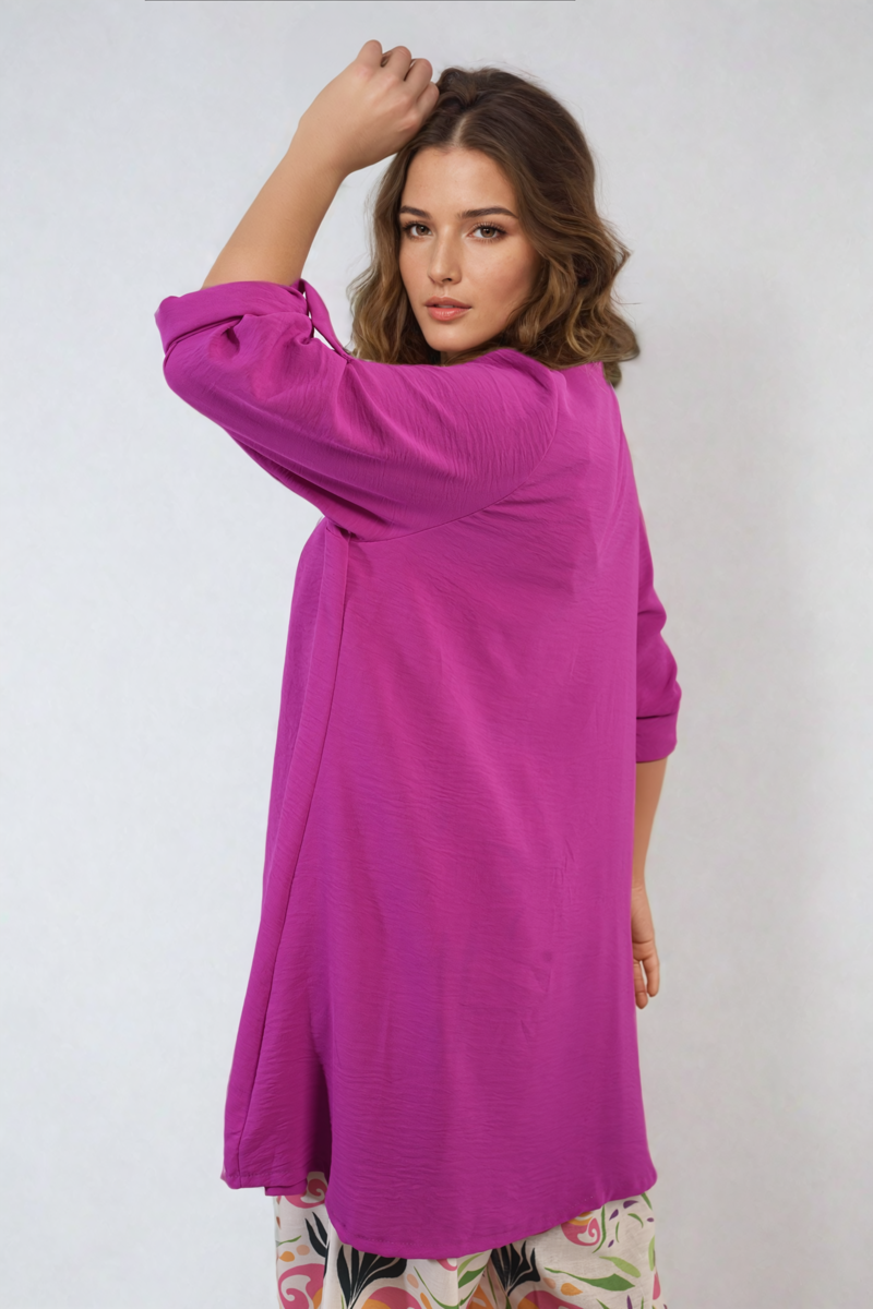 Magenta open-front cardigan with elbow-length roll sleeves and draped hem