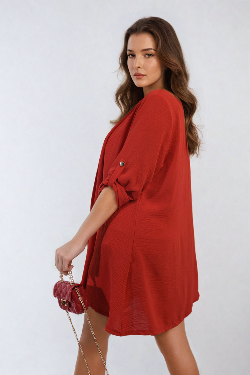 Red open-front cardigan with short roll sleeves and buttoned shoulder detail