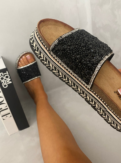 Black glitter platform slide sandals with wide strap and braided trim